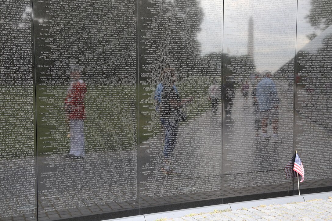 On Sept. 18, 2014, Staff Sgt. Michael Warnick performed Taps at the Korean War Veterans Memorial and the Vietnam Veterans Memorial for an Honor Flight from Odessa, Texas. This was the first Honor Flight from the Permian Basin region and included veterans from World War II, Korea, and Vietnam. (U.S. Marine Corps photo by Master Sgt. Kristin duBois/released)