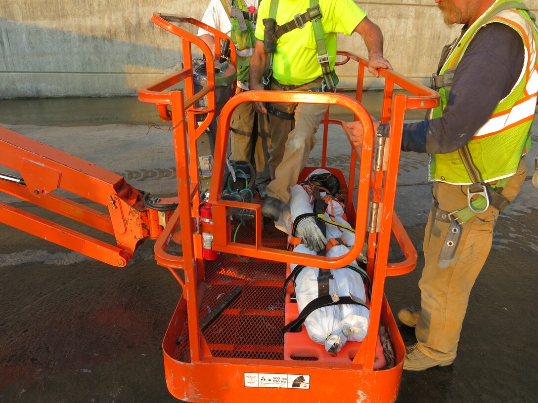 The purpose of fall retrieval/confined space rescue drills is to familiarize all on site employees with steps that need to be taken should a coworker become injured or incapacitated inside the blasting and painting containment.