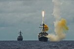 Arleigh Burke class guided missile destroyer USS Dewey (DDG 105) fires a Standard Missile (SM) 2 during Valiant Shield 2014. Valiant Shield is a U.S.-only exercise integrating U.S. Navy, Air Force, Army and Marine Corps assets, offering real world joint operational experience to develop capabilities that provide a full range of options to defend U.S. interests and those of its allies and partners. (U.S. Navy photo by Mass Communication Specialist Seaman David Flewellyn/Released)