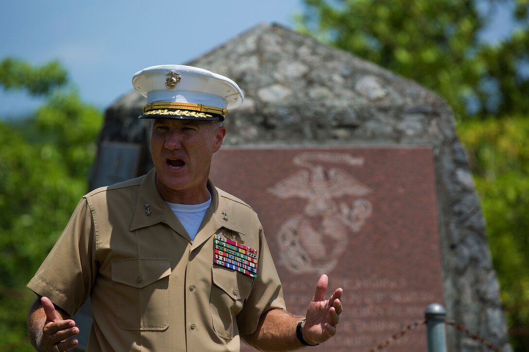 Maj. Gen. Charles L. Hudson, commander of Marine Corps Installations, Pacific gives remarks in front of the 1st Marine Division Memorial, during a tour of memorial sites around the island in honor of the 70th anniversary of the landing on Peleliu, Palau, Sept. 15. The battle following the landing would turn into one of the hardest fought battles for the Marines in the Pacific during World War II.