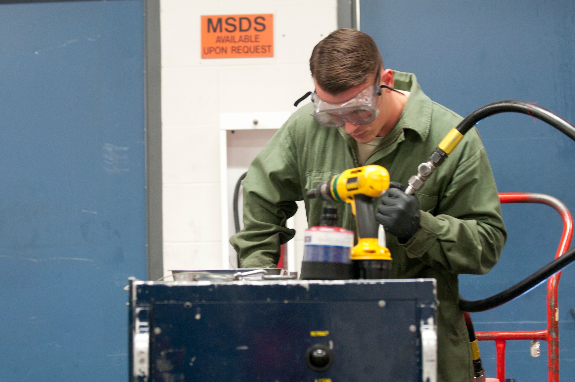 Airman 1st Class Joe Tucker, 90th Maintenance Operations Squadron Mechanical and Pneudraulics Shop, conducts an operational inspection of a hydraulic pump unit assembly on F.E. Warren Air Force Base, Wyo., Sept. 11, 2014. (U.S. Air Force photo by Lan Kim)