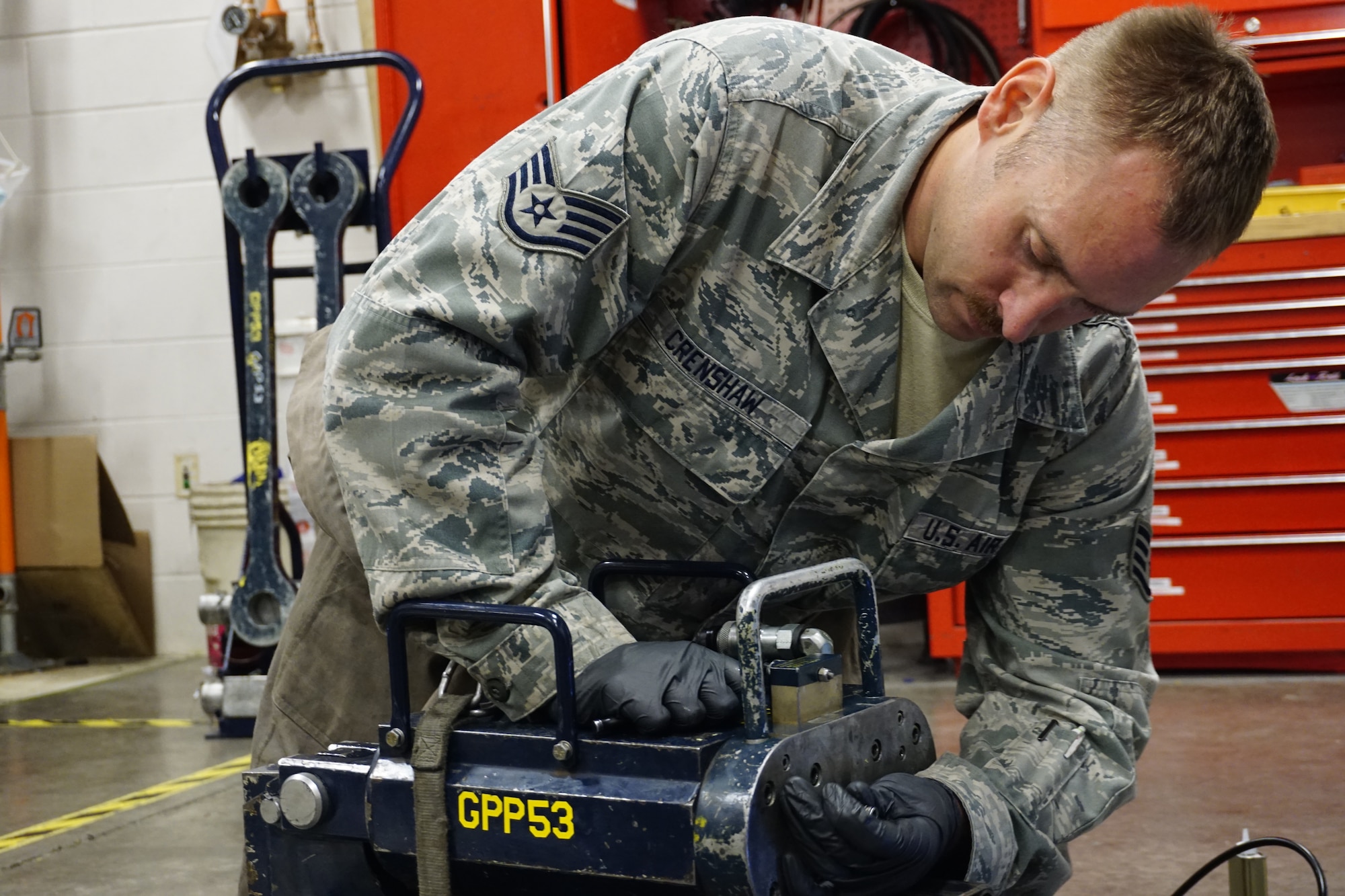 Staff Sgt. Luke Crenshaw, 90th Maintenance Operations Squadron Mechanical and Pneudraulic, conducts an operational inspection of a hydraulic pusher unit on F.E. Warren Air Force Base, Sept. 11, 2014. (U.S. Air Force photo by Lan Kim)
