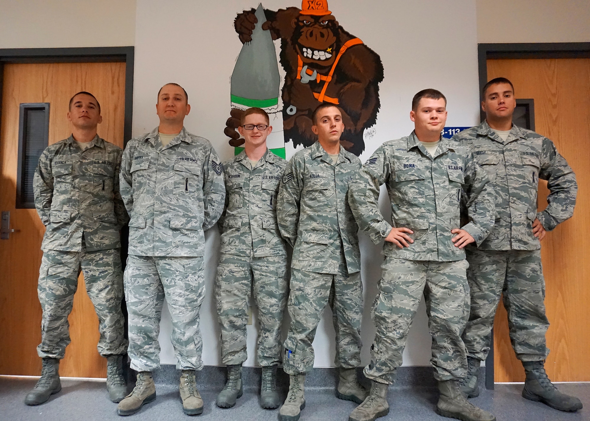 The 90th Missile Maintenace Squadron Missile Maintenance team for the 2014 Global Strike Challenge: Staff Sgt. Mihail Isvanca, Tech Sgt. Ruben Guerra, Senior Airman Jake McBroom, Staff Sgt. Nicholas Kolja, Senior Airman Robert Bona and Senior Airman Justin Seely. (U.S. Air Force photo by Lan Kim)
