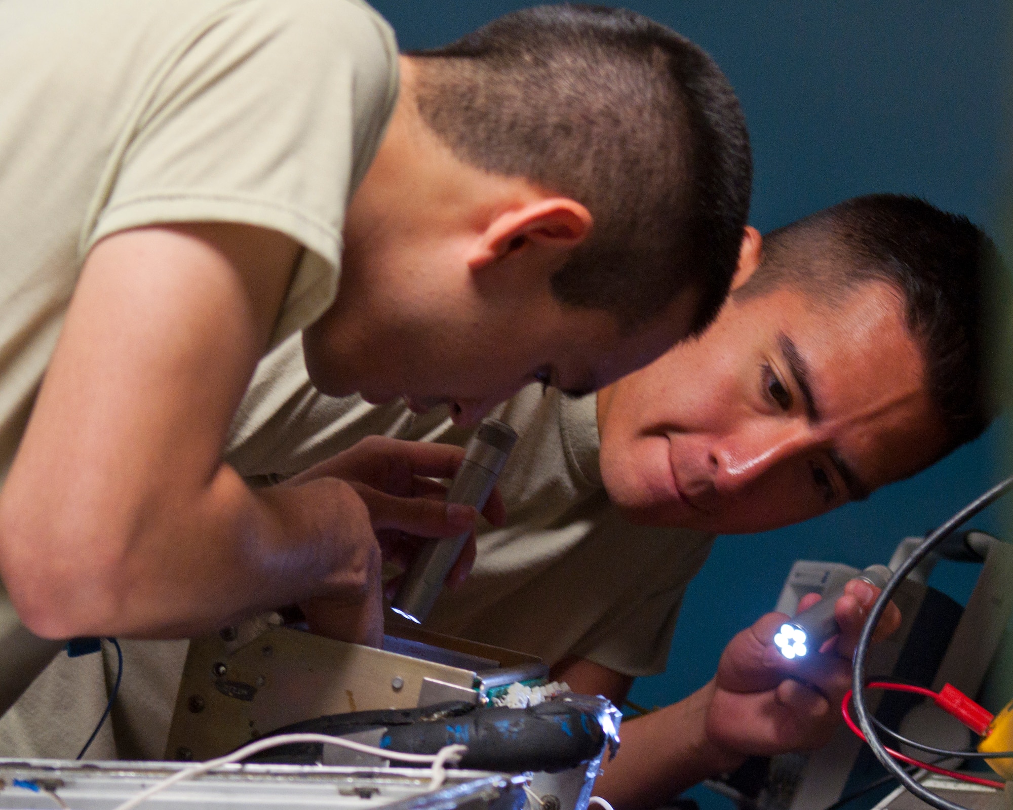 Staff Sgt. George Cornejo and Senior Airman Jerome Dufour, 90th Maintenance Operations Squadron Electronics Laboratory, inspect electronics used in the maintenance of the ICBM force Sept. 11, 2014. The two Airmen trained that day in preparation for the 2014 Global Strike Challenge. (U.S. Air Force photo by Senior Airman Jason Wiese)