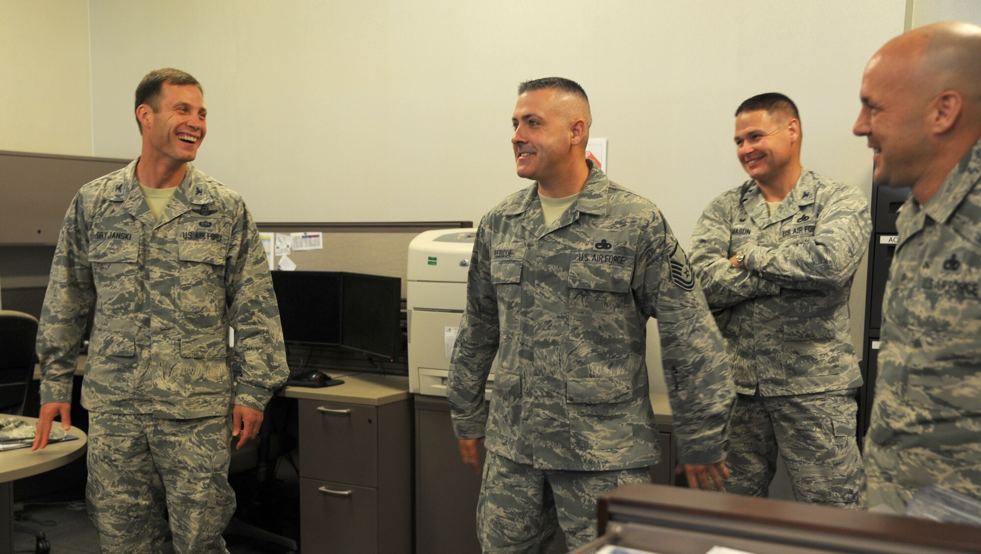 Col. James Dryjanski, 314th Airlift Wing commander, laughs as he tours the 314th Maintenance Group August 14, 2014, at Little Rock Air Force Base, Ark. Dryjanski visited the 314th MXG to meet with Airmen and learn how the 314th MXG manages operations. (U.S. Air Force photo by Airman 1st Class Mercedes Muro) 