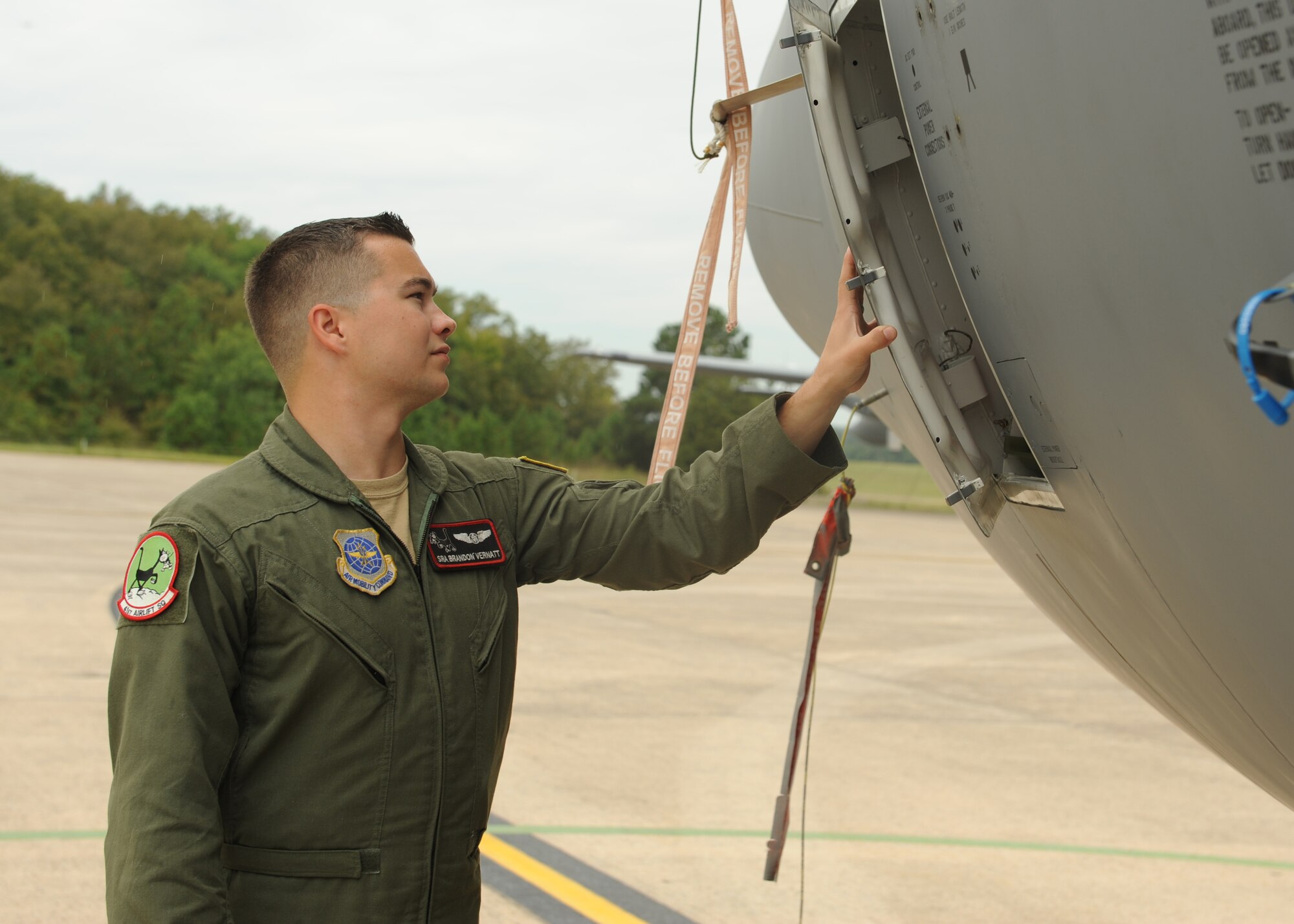 Senior Airman Brandon Vernatt, a 41st Airlift Squadron loadmaster, conducts a preflight inspection Sept. 15, 2014, at Little Rock Air Force Base, Ark. Vernatt schedules an average of 30 flights a week, working alongside pilot schedulers to ensure proper qualifications and training requirements are met. (U.S. Air Force photo by Airman 1st Class Scott Poe)