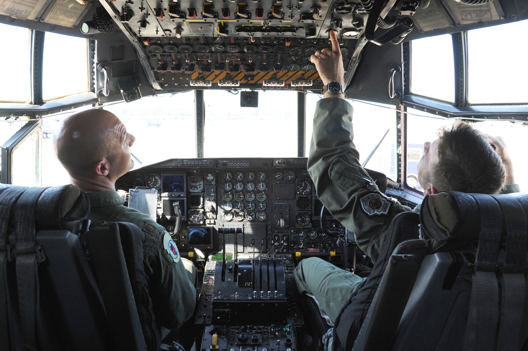 Maj. Justin Kershaw, 50th Airlift Squadron director of operations, and Lt. Col. Michael Fellona, 50th AS commander, power up a C-130H3 Sept. 3, 2014 at Little Rock Air Force Base, Ark. Kershaw and Fellona powered up the last active-duty C-130H3 before it leaves Little Rock AFB. (U.S. Air Force photo by Airman 1st Class Mercedes Muro) 