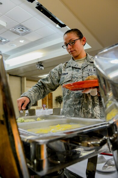 U.S. Air Force Staff Sgt. Kendall O’Steen, 23d Equipment Maintenance Squadron munitions inspector, serves herself lunch during the Air Force Birthday Lunch Buffet  Sept. 18, 2014, at Moody Air Force Base, Ga. The Air Force separated from the Army Sept. 18, 1947, to become its own service. (U.S. Air Force photo by Airman 1st Class Sandra Marrero/Released)
