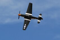 A vintage P-51 Mustang fighter aircraft executes a bank during the National Championship Air Races in Reno, Nev., Sept. 13, 2014. The air races have been held annually since 1963. (U.S. Air Force photo by Staff Sgt. Robert M. Trujillo/Released)