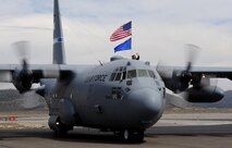 A C-130 Hercules lands during the National Championship Air Races in Reno, Nev., Sept. 13, 2014. The Hercules has been in production for more than 50 years. (U.S. Air Force photo by Staff Sgt. Robert M. Trujillo/Released)