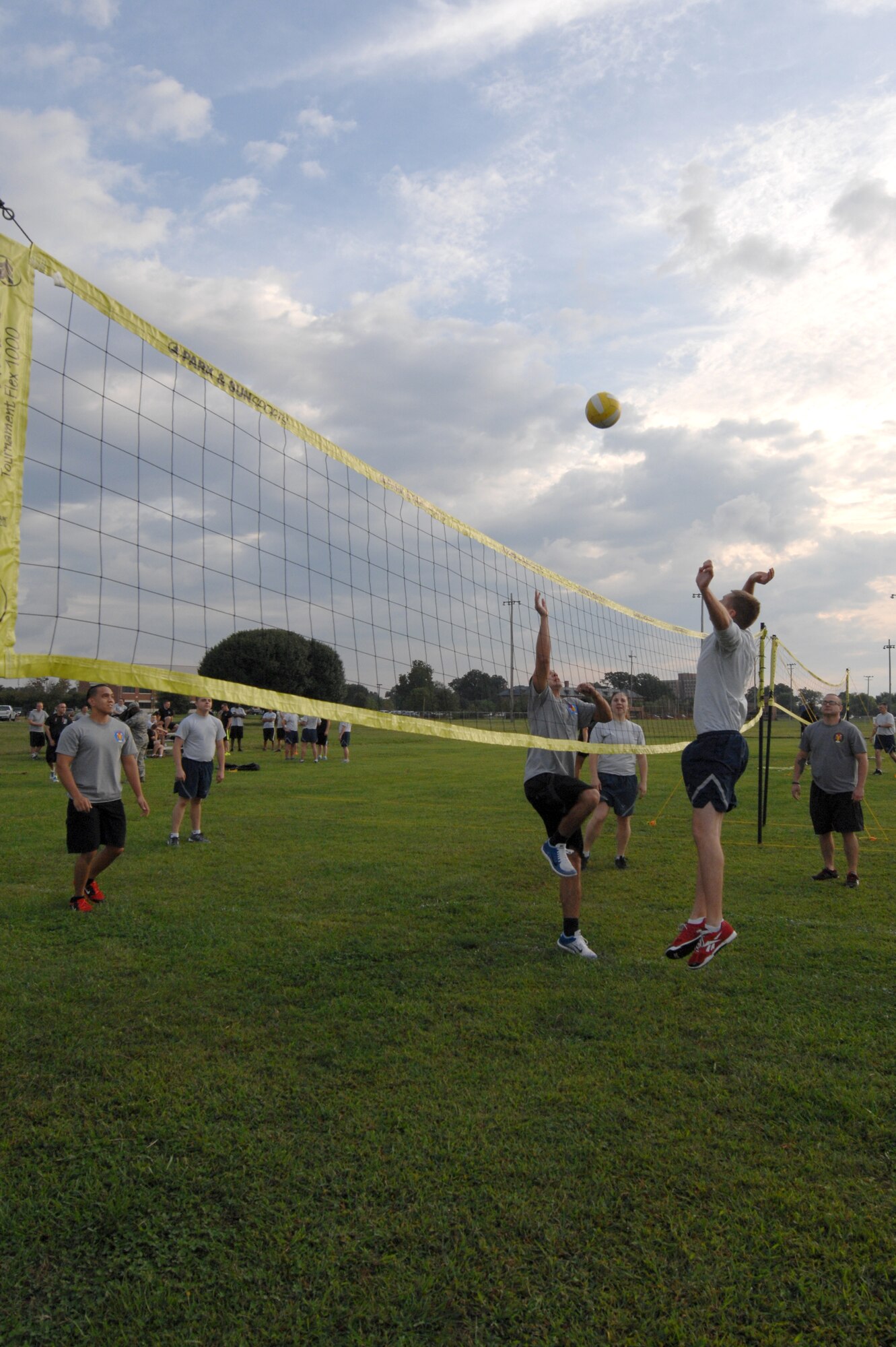 U.S. Air Force Airmen prepare to spike a volleyball at the 2014 480th Intelligence, Surveillance and Reconnaissance Wing Warrior Challenge at Langley Air Force Base, Sept. 17, 2014. The warrior challenge also included tug-o-war and basketball games. (U.S. Air Force photo by Airman 1st Class Breonna Veal/Released)(This photo was cropped and color corrected to emphasize the subjects)