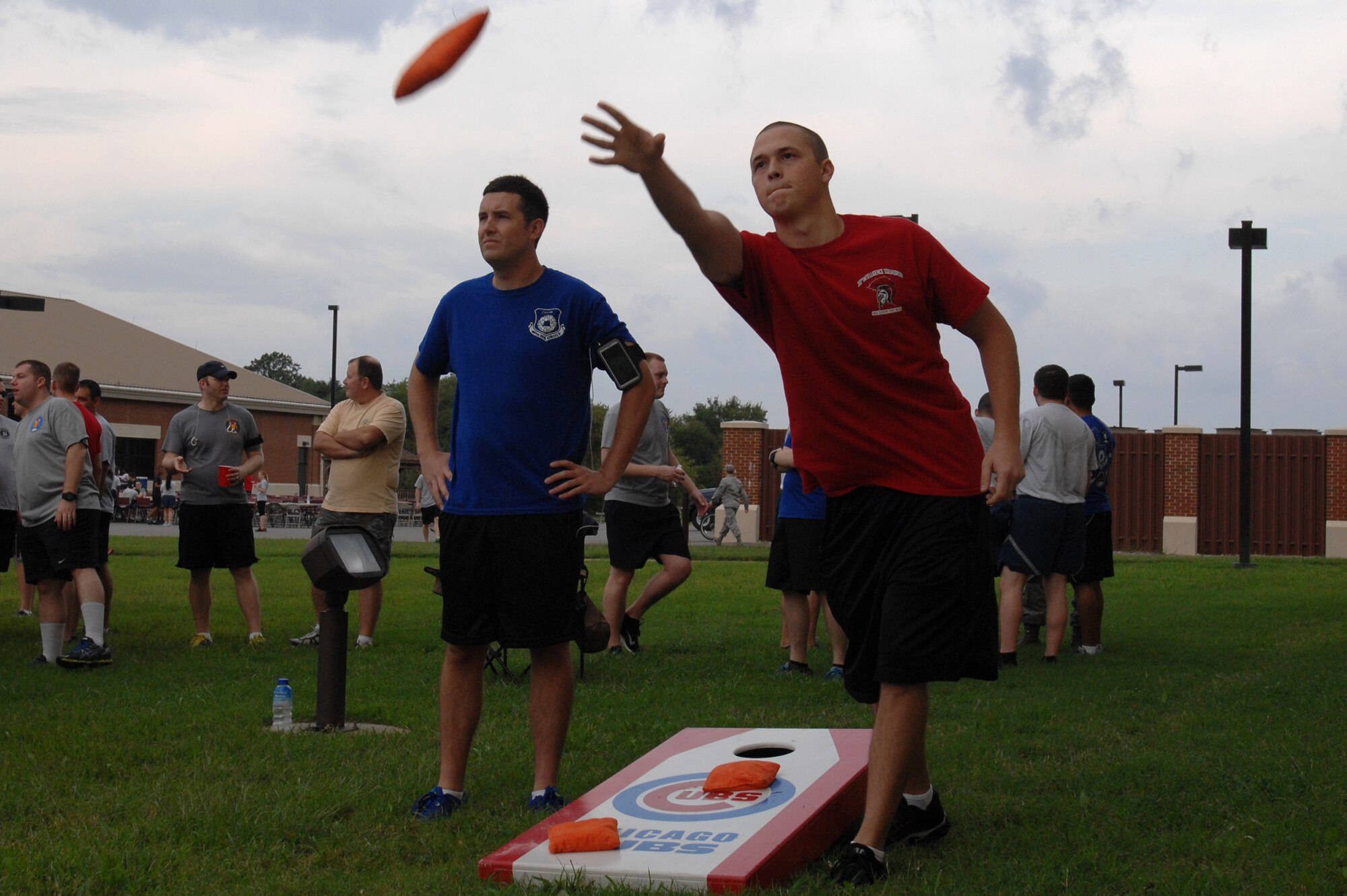 A U.S. Air Force Airman 1st Class assigned to the 30th Intelligence Squadron throws a bean bag during the 2014 480th Intelligence, Surveillance and Reconnaissance Wing Warrior Challenge at Langley Air Force Base, Sept. 17, 2014. The 480th ISR Warrior Challenge also included events like an Air Force Knowledge Bowl, in which Airmen tested each other’s Air Force knowledge through trivia. (U.S. Air Force photo by Airman 1st Class Breonna Veal/Released)