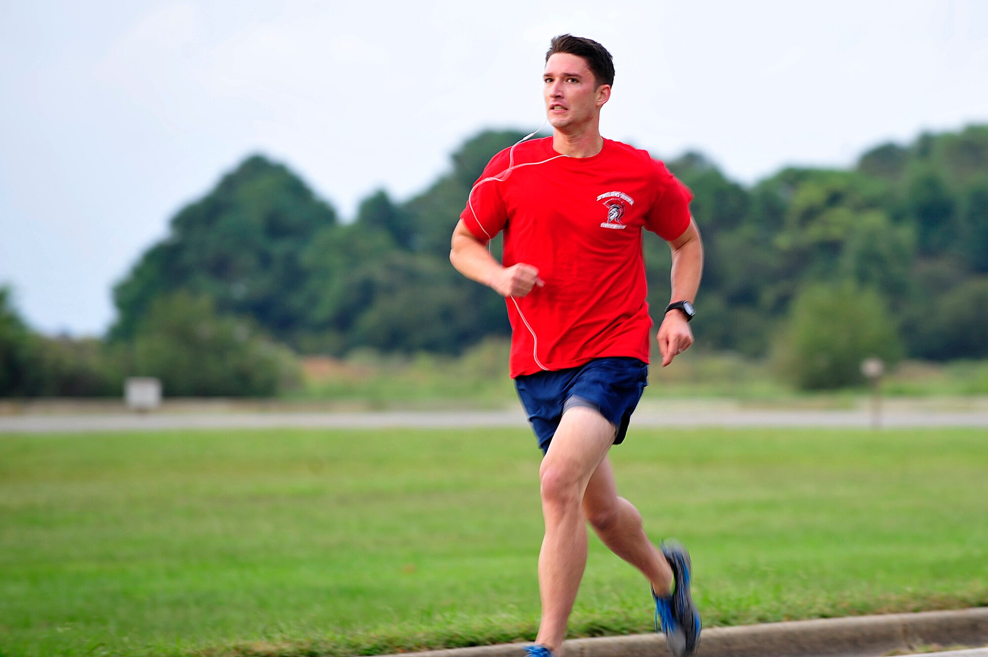 U.S. Air Force Capt. Chad Raney, 30th Intelligence Squadron D-Flight commander, participates in a one-and-half-mile run during the 2014 480th Intelligence, Surveillance and Reconnaissance Wing Warrior Challenge at Langley Air Force Base, Sept. 17, 2014. Raney was the first male runner to cross the finish line with a time of eight minutes and 37 seconds. (U.S. Air Force photo by Airman 1st Class Breonna Veal)