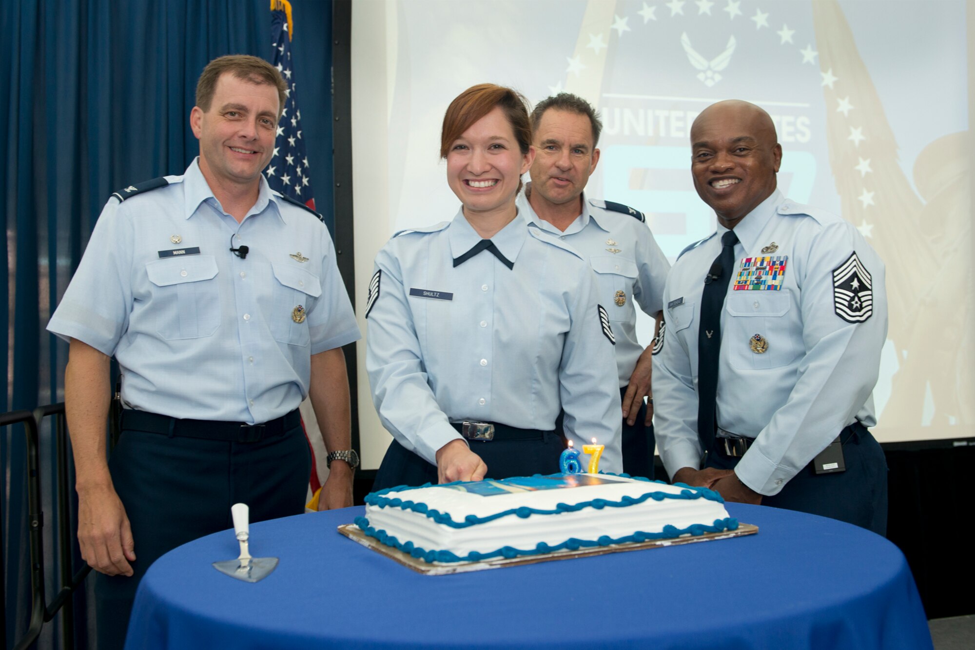 Col. Eric W. Mann, vice commander of the Air National Guard Readiness Center, Joint Base Andrews, Md., Technical Sgt. Kristin N. Shultz, Col. Gary Szabo, and Chief Master Sgt. Tony Whitehead, the command chief of the ANGRC, cut a cake to commemorate the 67th birthday of the United States Air Force, Sept. 18, 2014. In 1947, the National Security Act turned what was then known as the Army Air Corps into the Department of the Air Force. Today’s Air Force is comprised of more than 680,000 Airmen, made up of active duty, reservists, guardsmen and civilians, who support more than 5,600 aircraft, 450 intercontinental ballistic missiles and 63 satellites. Today's Air Force is the world's preeminent air, space and cyberspace force with an ability to rapidly adapt to uncertainty, ensuring future success. (Air National Guard photo by Master Sgt. Marvin R. Preston/Released)
