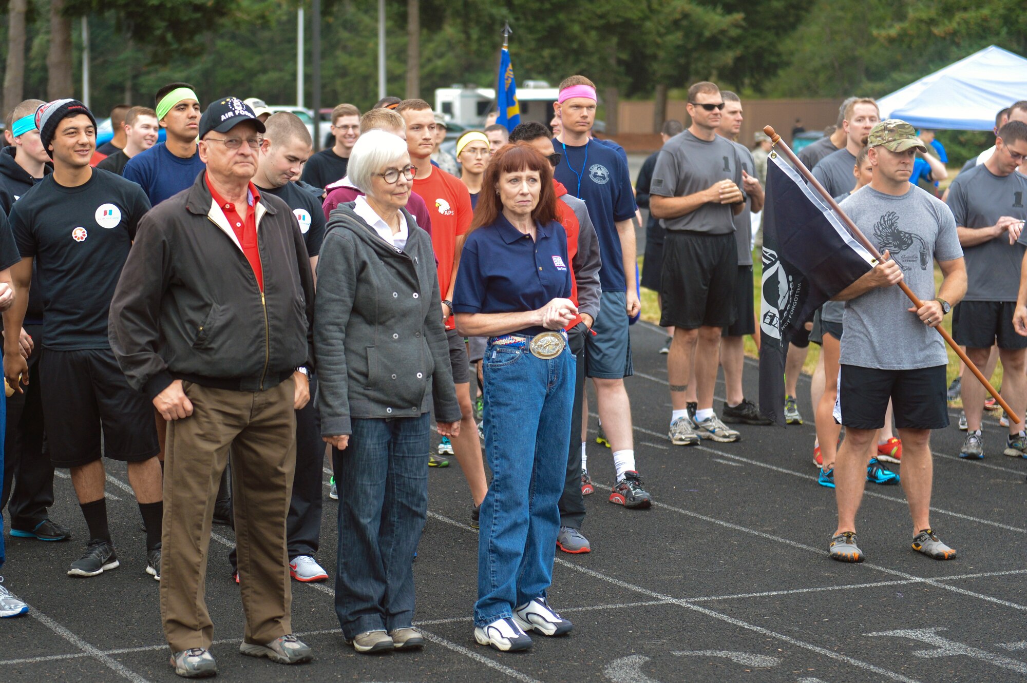 Friends and family members of Capt. Douglas Ferguson, Vietnam POW/MIA Airman, lead Team McChord Airmen from the front Sept. 17, 2014, before the 2nd Annual POW/MIA 24-hour run at Joint Base Lewis-McChord, Wash. The first lap of the run was dedicated to Ferguson, who was finally brought home and laid to rest in May after his F-4D Phantom aircraft was shot down in Laos in 1969 during the Vietnam War. (U.S. Air Force photo/Staff Sgt. Russ Jackson)