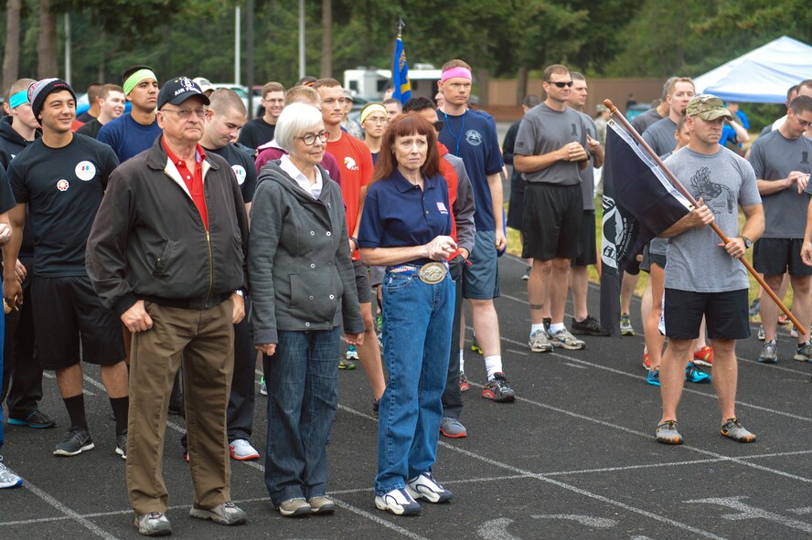 Friends and family members of Capt. Douglas Ferguson, Vietnam POW/MIA Airman, lead Team McChord Airmen from the front Sept. 17, 2014, before the 2nd Annual POW/MIA 24-hour run at Joint Base Lewis-McChord, Wash. The first lap of the run was dedicated to Ferguson, who was finally brought home and laid to rest in May after his F-4D Phantom aircraft was shot down in Laos in 1969 during the Vietnam War. (U.S. Air Force photo/Staff Sgt. Russ Jackson)
