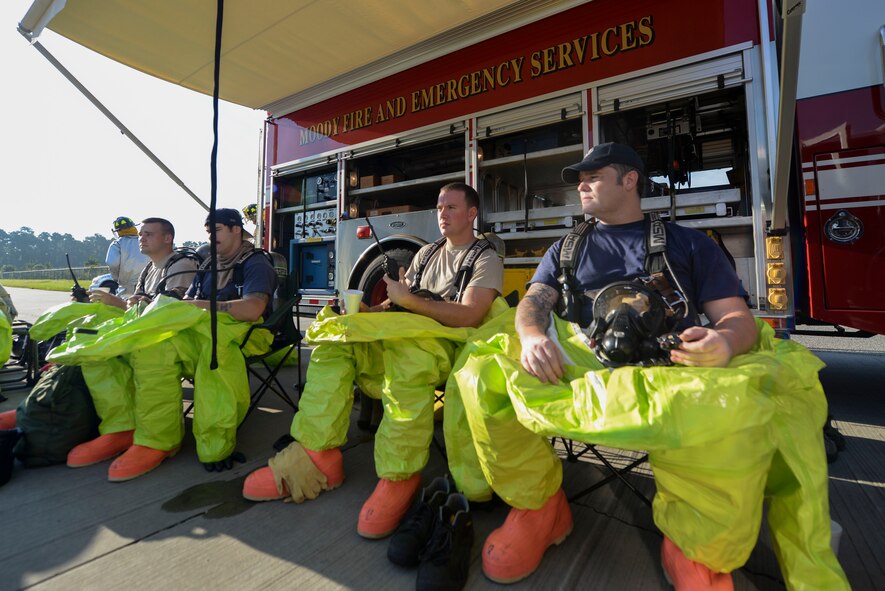 Members of the 23d Civil Engineer Squadron wait for instruction during an exercise Sept. 18, 2014, at Moody Air Force Base, Ga. The exercise focused on the 23d Wing’s hazardous material response and rescue capabilities. (U.S. Air Force photo by Airman 1st Class Dillian Bamman/Released)