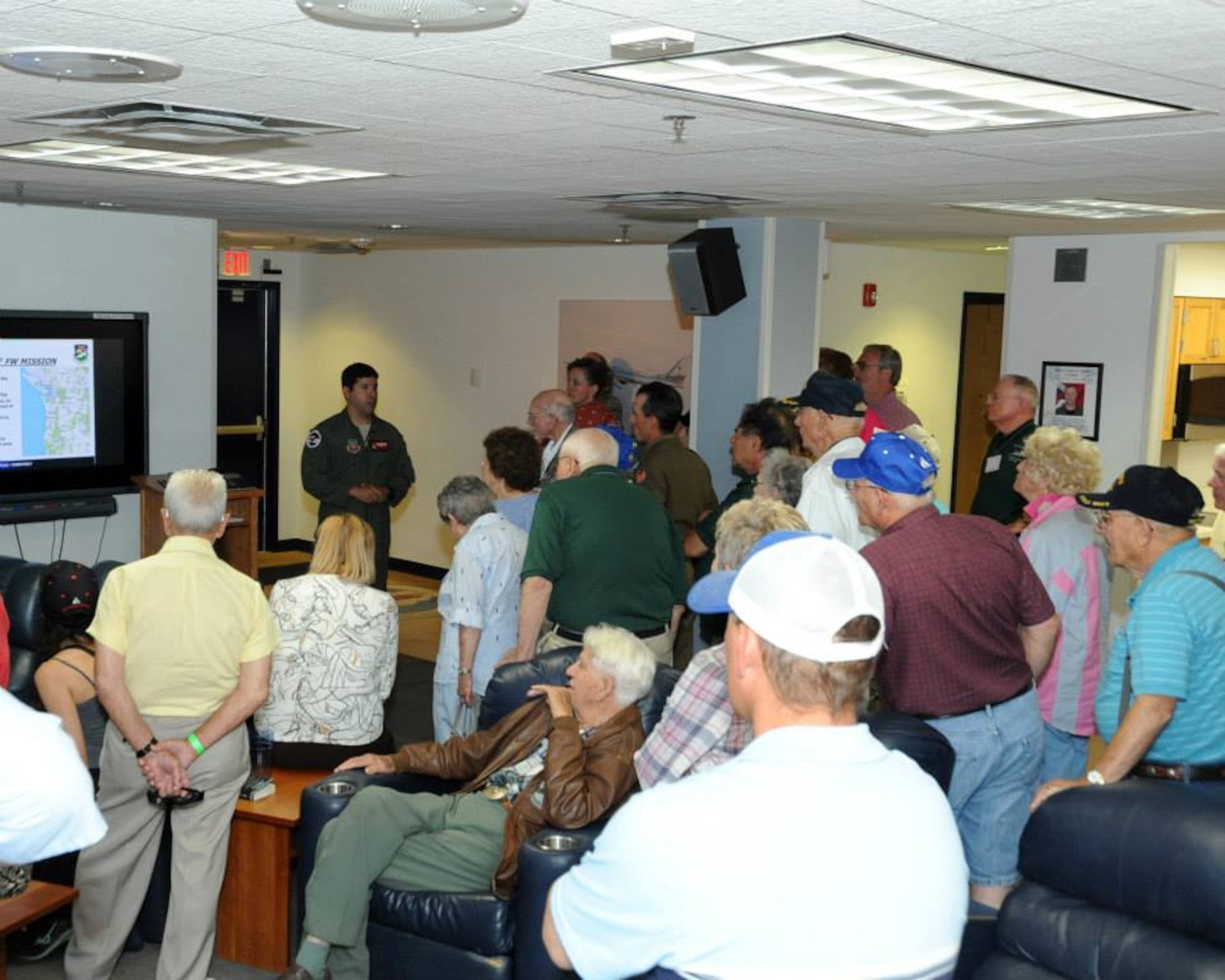 Maj. Paul Shamy of the 123rd Fighter Squadron briefs visiting members of the 381st Bomb Group (H) Memorial Association on the unit’s aerospace control alert mission at Portland Air National Guard Base on Sept. 4, 2014.  (U.S. Air National Guard photo by Master Sgt. Shelly Davison, 142nd Fighter Wing Public Affairs.)