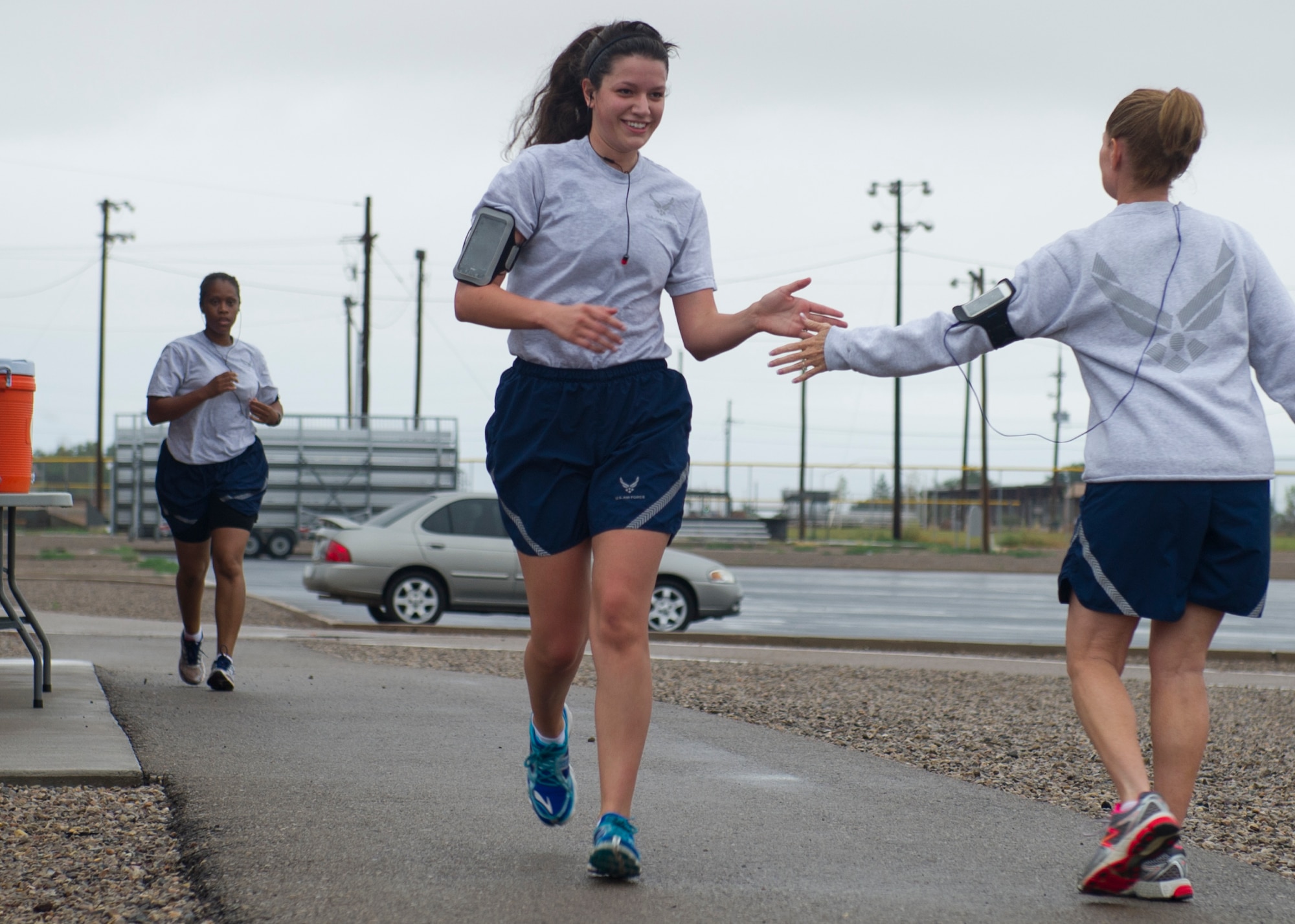 Chief Master Sgt. Wendy Rowe, 49th Materiel Maintenance Group, encourages Airman 1st Class Madeline Ericson, 49th Wing Judge Advocate civil law paralegal, as she finishes the Air Force Birthday 5K at Holloman Air Force Base, N.M., Sept. 18. On September 18, 1947 the U.S. Air Force was officially recognized as an independent military service, leaving behind its former role, the U.S. Army Air Corps. This year marks 67 years of the USAF leading the world in air superiority, space and cyberspace. "The future of our nation is forever bound up in the development of Air Power," Brigadier General Billy Mitchell, United States Army Air Service. (U.S. Air Force photo by Senior Airman Leah Ferrante/Released) 