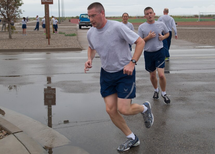 Despite the rainy New Mexico weather, members of Team Holloman came together to run a 5K in honor of the  Air Force Birthday at Holloman Air Force Base, N.M., Sept. 18. On September 18, 1947 the U.S. Air Force was officially recognized as an independent military service, leaving behind its former role, the U.S. Army Air Corps. This year marks 67 years of the USAF leading the world in air superiority, space and cyberspace. "The future of our nation is forever bound up in the development of Air Power," Brigadier General Billy Mitchell, United States Army Air Service. (U.S. Air Force photo by Senior Airman Leah Ferrante/Released) 