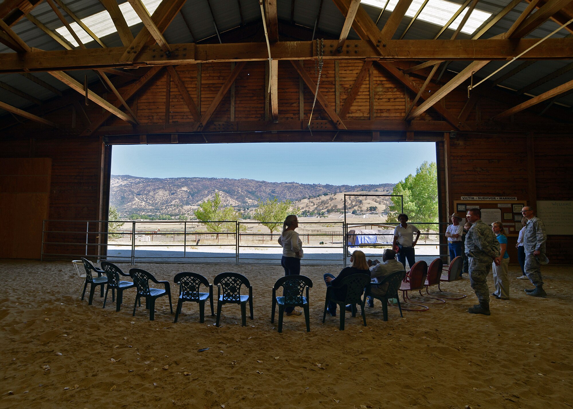 Charisse Rudolph (center), Healing Horses and Armed Forces founder, shows members of the Edwards Air Force Base Integrated Delivery System one of the locations they use for equine-assisted and adventure-based counseling Sept. 11 during an IDS visit to the Healing Horses and Armed Forces (HHAAF) at Rising Moon Ranch, in Tehachapi, Calif. The visit to the ranch was intended to improve the collaboration between the two helping agencies and to better understand the services offered to veterans, servicemembers and their families by HHAAF. (U.S. Air Force photo by Jet Fabara)