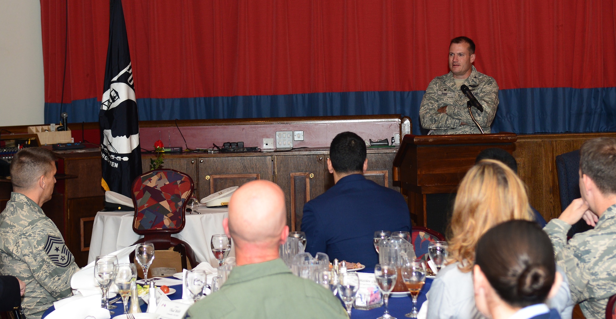 U.S. Air Force Col. Kenneth T. Bibb Jr., 100th Air Refueling Wing commander, gives closing remarks to guest of the Prisoner of War/Missing in Action Fallen Comrades Committee luncheon Sept. 17, 2014, at the Galaxy Club on RAF Mildenhall, England. Bibb mentioned his gratitude for everyone who helped put together the luncheon. (U.S. Air Force photo/Airman 1st Class Jonathan Light/Released)