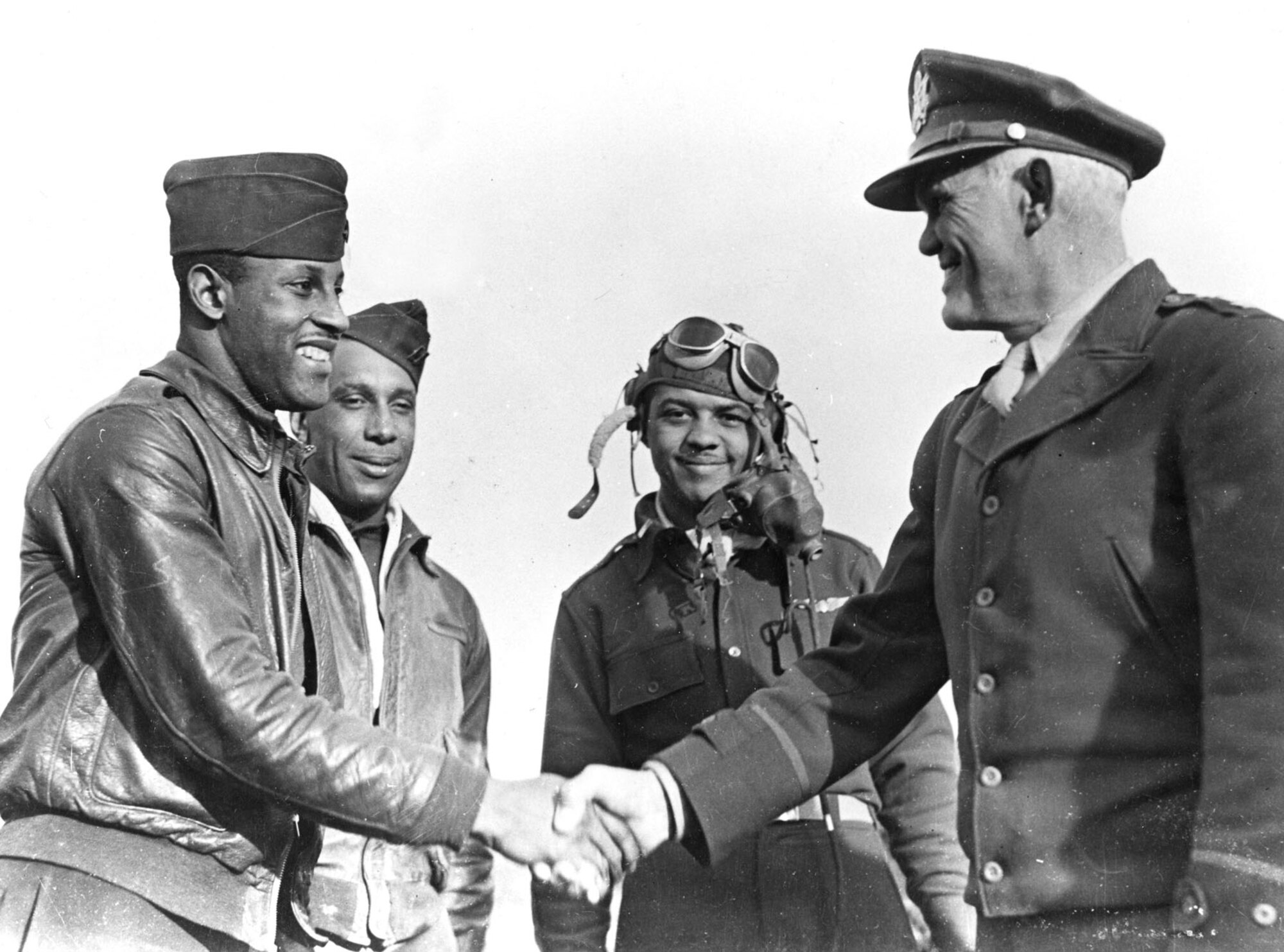 12th Air Force Commander Maj. Gen. John Cannon congratulates Capt. Hall of 99th Fighter Squadron while stationed in Italy, in February 1944. (Courtesy Photo) 