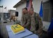 U.S. Air Force Brig. Gen. Mark Kelly, 455th Air Expeditionary Wing commander, Airman 1st Class Parker Heideman, 100th Expeditionary Fighter Squadron and Lt. Col. James Haraak, 455th Expeditionary Medical Group, cut the ceremonial cake during the Air Force’s 67th anniversary at Bagram Airfield, Afghanistan Sept. 18, 2014. Haraak and Heideman represented the most senior and most junior Airmen in attendance at the ceremony.  (U.S. Air Force photo by Staff Sgt. Evelyn Chavez/Released)