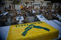 U.S. Air Force Airmen from the 455th Air Expeditionary Wing attend a cake cutting ceremony at Bagram Airfield, Afghanistan Sept. 18, 2014.  The Airmen celebrated the Air Force’s 67th anniversary.  (U.S. Air Force photo by Staff Sgt. Evelyn Chavez/Released)