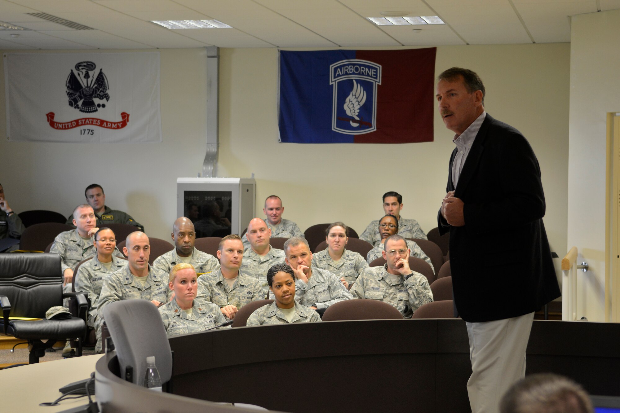 James Hunter, international best-selling author, speaks with commanders, officers, chiefs and first sergeants during a leadership development seminar, Sept. 15, 2014, at Aviano Air Base, Italy. With 35 years of experience, Hunter’s seminar focused on practicing servant leadership as a means to effectively inspire and motivate a group of people to excellence. (U.S. Air Force photo/Staff Sgt. Jessica Hines) 