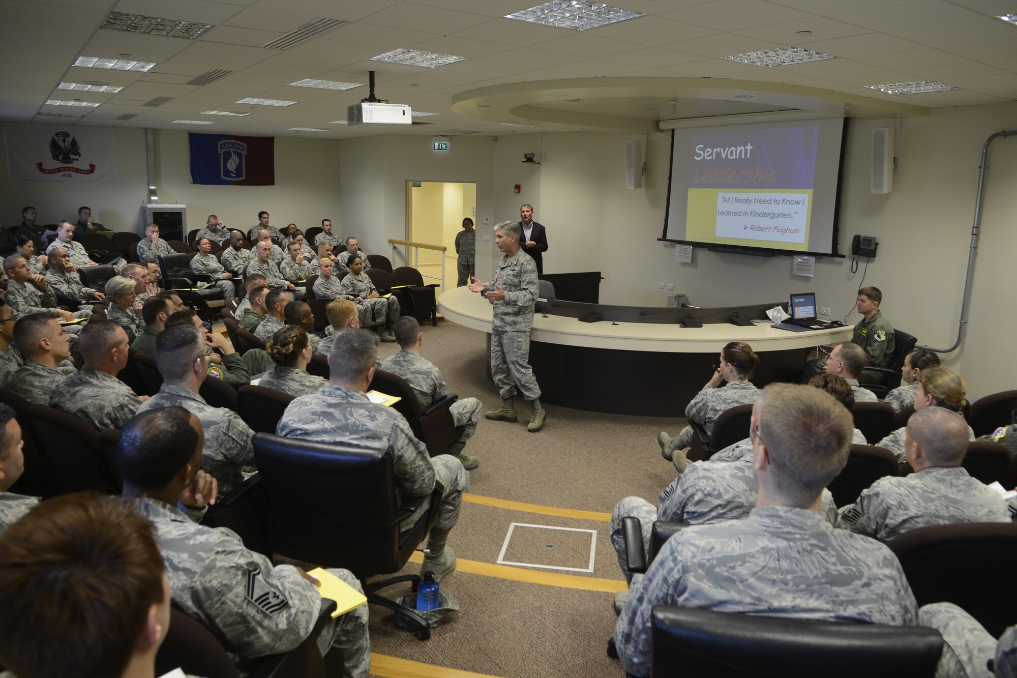 Brig. Gen. Barre Seguin, 31st Fighter Wing commander, talks with commanders, officers, chiefs and first sergeants before a leadership development seminar, Sept. 15, 2014, at Aviano Air Base, Italy. Taught by internationally recognized author, James Hunter, the seminar focused on practices and principles of servant leadership. (U.S. Air Force photo/Staff Sgt. Jessica Hines) 