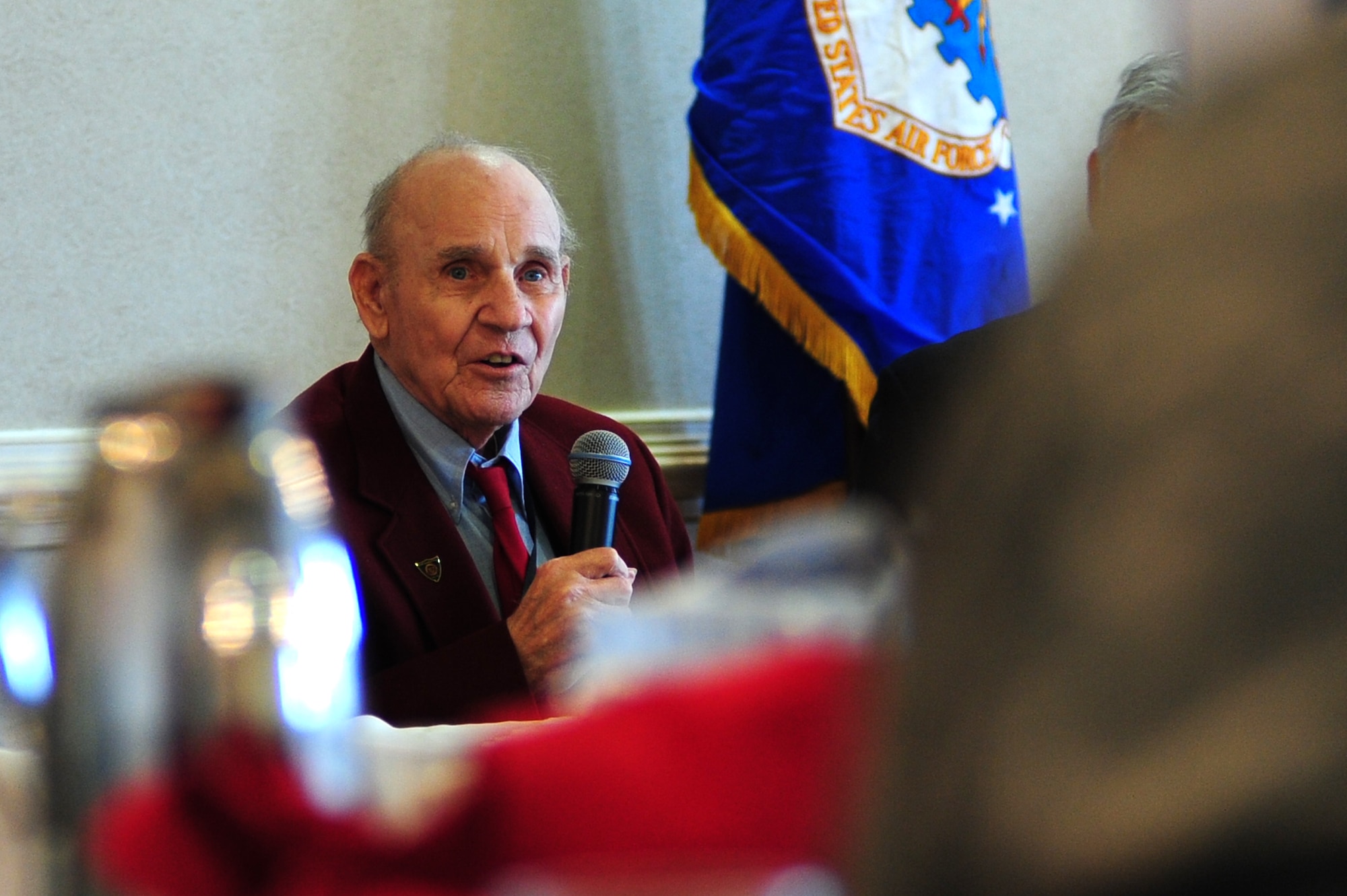 Shellie Woodell, WWII veteran and former POW, answers U.S. Service members’ questions during a POW/MIA luncheon at Langley Air Force Base, Va., Sept. 17, 2014. Attendees were given the opportunity to ask Woodell questions about his experience as a POW. There are more than 83,000 American Service members missing from WWII, the Korean War, the Cold War, the Vietnam War and the 1991 Gulf War,. (U.S. Air Force photo by Airman 1st Class Areca T. Wilson/Released) 