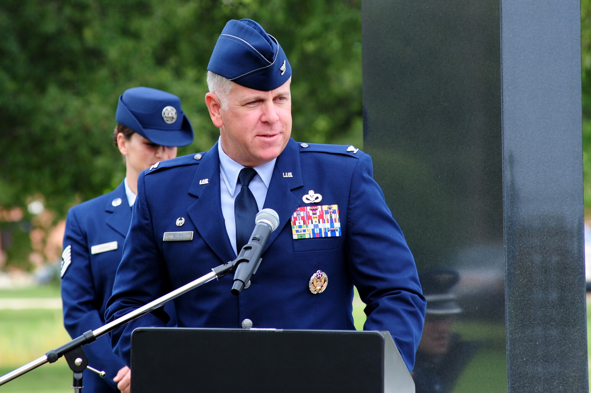 U.S. Air Force Col. John J. Allen Jr., 633rd Air Base Wing commander, addresses audience members during the 2014 POW/MIA Ceremony at Langley Air Force Base, Va., Sept. 17, 2014. The ceremony was held to honor those captured and missing in action during war. (U.S. Air Force photo by Airman 1st Class Areca T. Wilson/Released) 