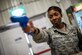 Staff Sgt. Heather Witherspoon, 386th Expeditionary Security Forces Squadron training non-commissioned officer in charge, engages Airmen from the 386th Expeditionary Communications Squadron during an active shooter training response exercise Sept. 5, 2014. The Check Six team conducts active shooter incident response with units across the wing to ensure Airmen are able to escape, barricade or fight. (U.S. Air Force photo by Staff Sgt. Jeremy Bowcock)
