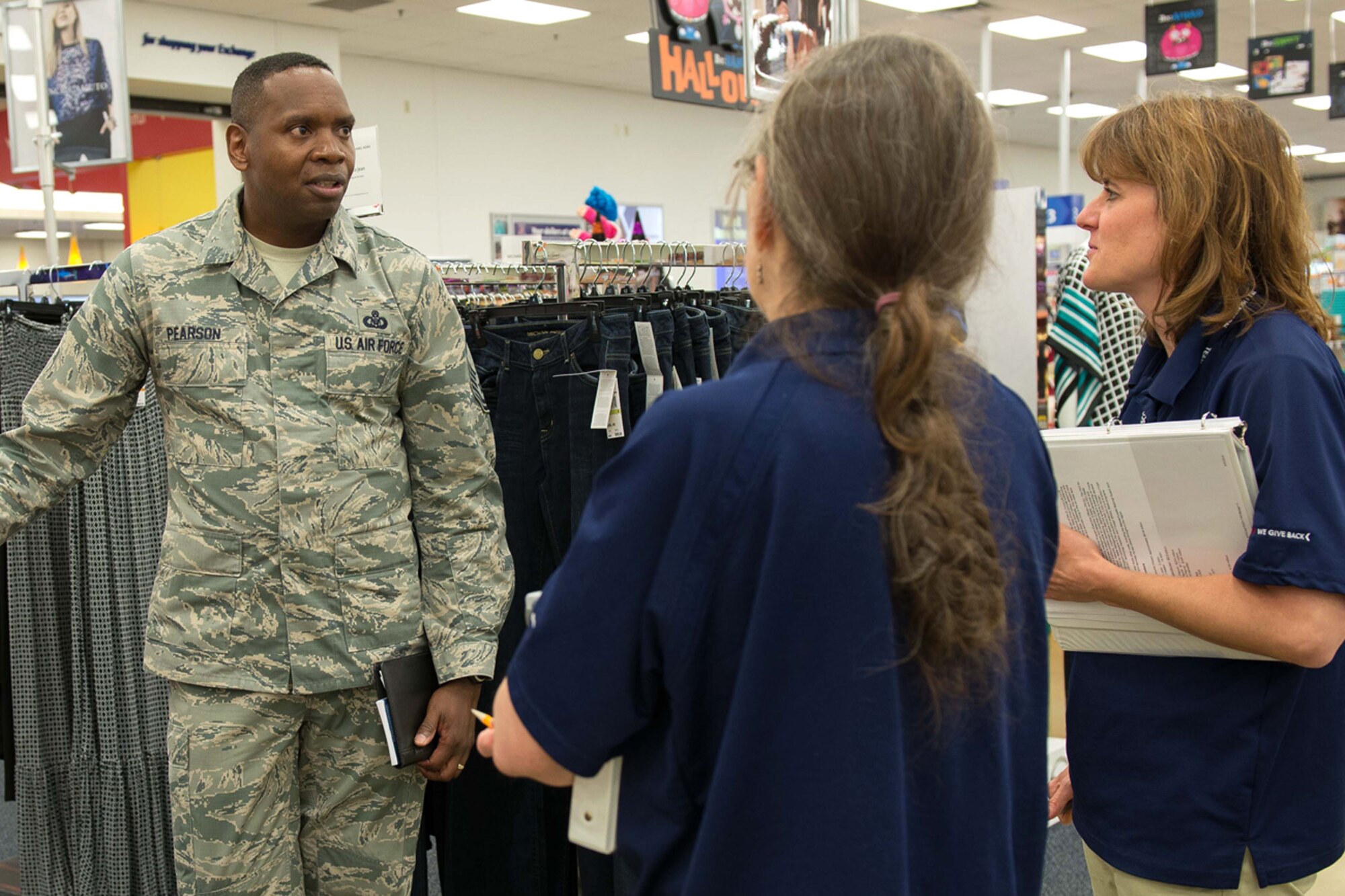 Chief Master Sgt. Anthony Pearson, Army and Air Force Exchange Service senior enlisted advisor, meets with Debbie Timothy (right), Hanscom Exchange store manager, and JoAnn Grant during a visit to the Hanscom AAFES complex Sept. 17. During the visit, Pearson toured the facilities, met with base leadership and with Airmen to learn how the Exchange can better serve Airmen and their families. (U.S. Air Force photo by Mark Herlihy)