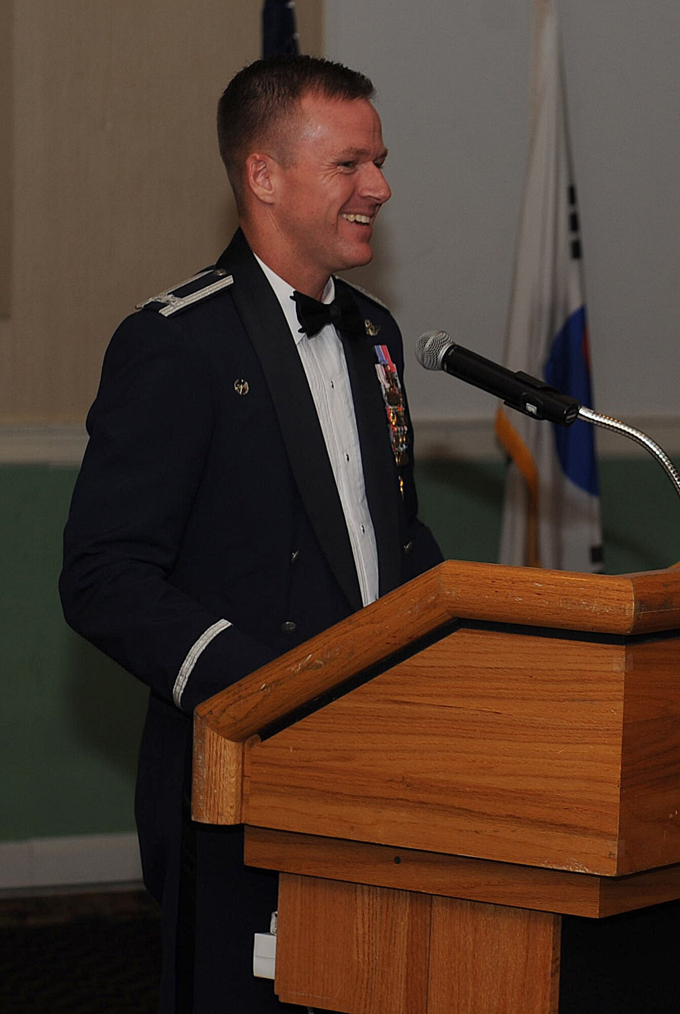 Col. Ken “Wolf” Ekman, 8th Fighter Wing commander, welcomes all distinguished military and civilian guests to Kunsan Air Base during the 40th anniversary ceremony Sept. 17, 2014.  Members of the 8 FW and community members of Gunsan City celebrated 40 years of partnership at Kunsan Air Base with an evening of dinner and reminiscing fond memories. (U.S. Air Force photo by Senior Airman Divine Cox)