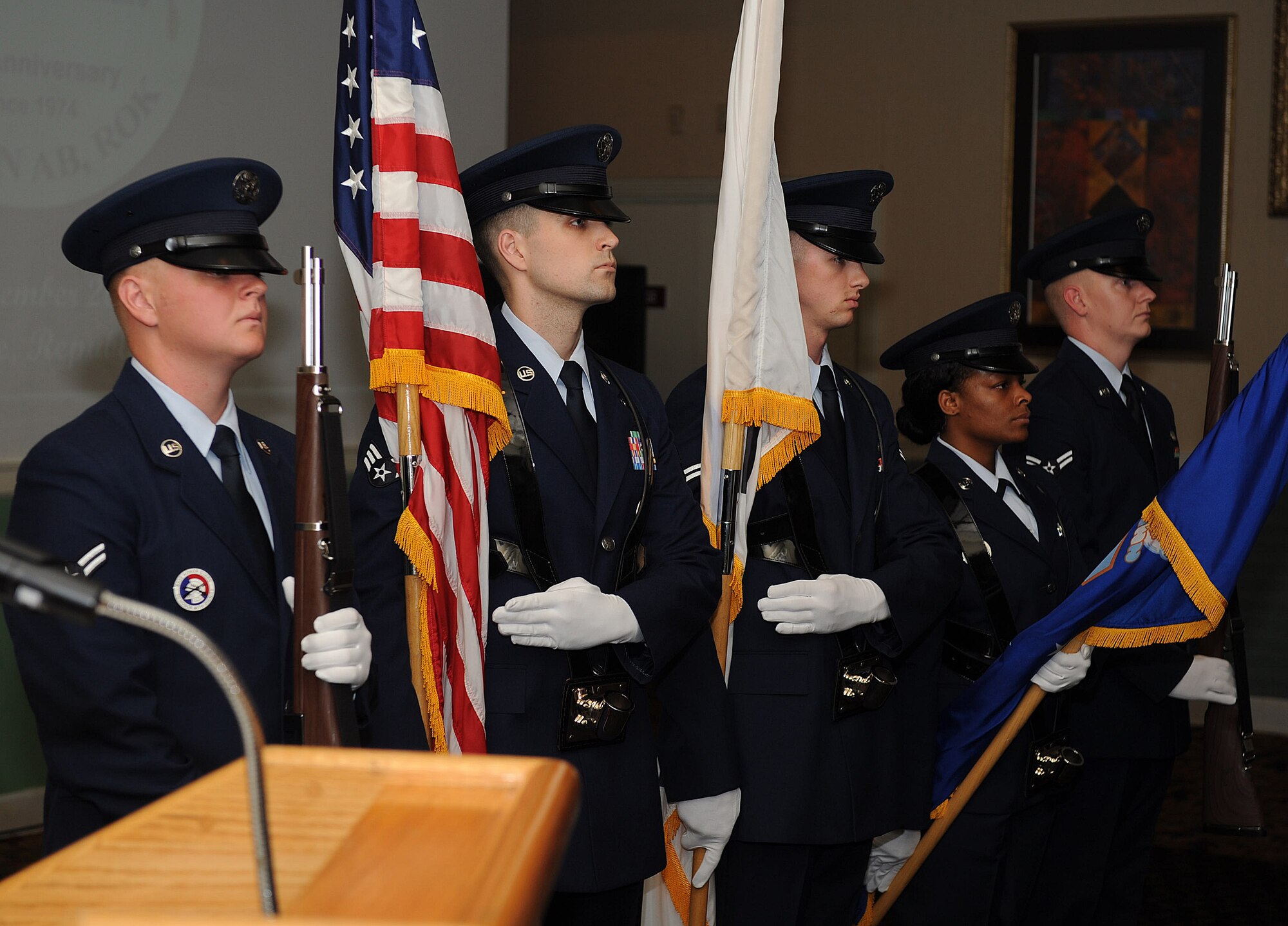 Wolf Pack Honor Guardsmen post the colors at the 8th Fighter Wing 40th anniversary ceremony at Kunsan Air Base, Republic of Korea, Sept. 17, 2014.  Members of the 8 FW and community members of Gunsan City celebrated 40 years of partnership at Kunsan Air Base with an evening of dinner and reminiscing fond memories. (U.S. Air Force photo by Senior Airman Divine Cox)