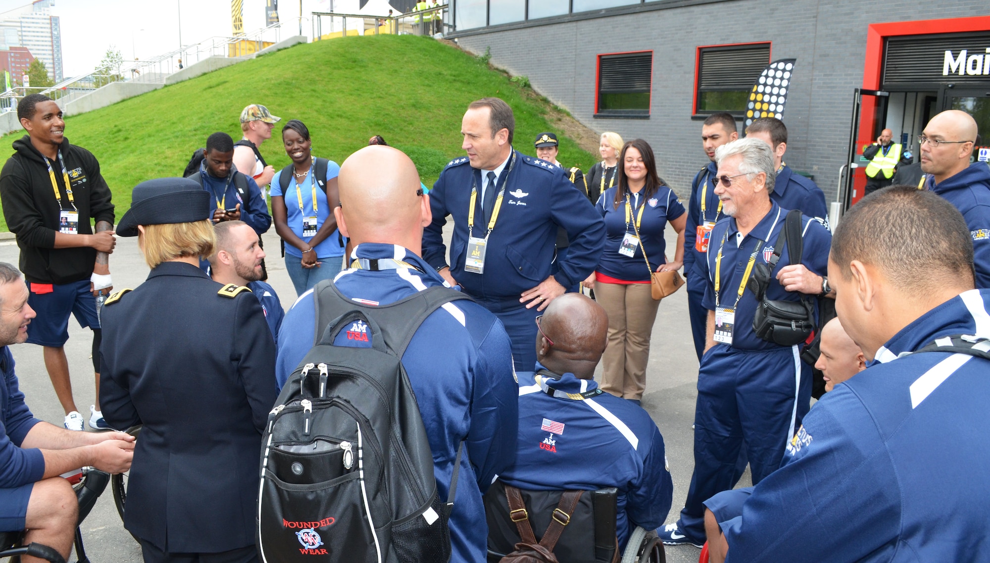 Lt. Gen. Tom Jones, U.S. Air Forces in Europe-Air Forces Africa vice commander, meets with U.S. team members outside the Copper Box Arena in Queen Elizabeth Olympic Park in London during the Invictus Games Sept. 13.  The general took the opportunity to witness the impact of competitive adaptive sport first-hand by attending several matches, and  getting to know the U.S. athletes, coaches and families, developing a personal understanding of the road to recovery through adaptive sports. (U.S. Air Force photo by Capt. Carolyn Glover/Released)



