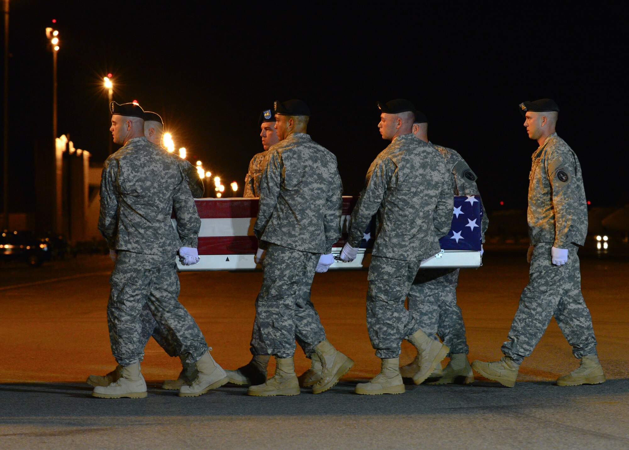 A U.S. Army carry team transfers the remains of Stephen F. Byus, of Reynoldsburg, Ohio, Sept. 17, 2014, at Dover Air Force Base, Del. Byus was assigned to the Combined Security Transition Command, Afghanistan. (U.S. Air Force photo/Airman 1st Class William Johnson)