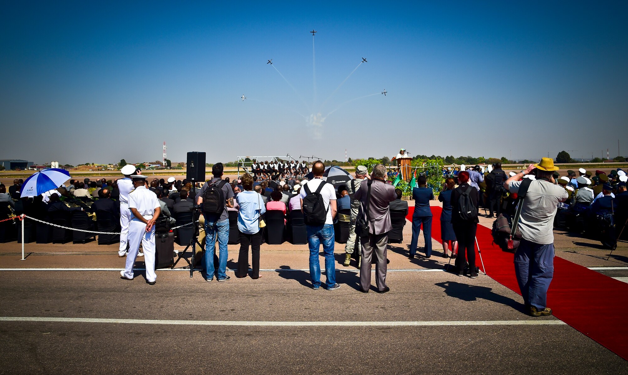 The South African air force Air Demonstration Team, the Silver Falcons, perform a starburst during the conclusion of South Africa’s Minister of Defense and Military Veterans, address to senior international defense leaders, patrons and trade-show exhibiters, signifying the beginning of the trade show and exhibition phase of the Africa Aerospace and Defence Expo 2014 Sept. 17, 2014, at Waterkloof Air Force Base, South Africa. The South Africa air demonstration team consists of five PC-7 Mk II Astra turboprop trainers. (U.S. Air Force photo/Staff Sgt. Travis Edwards-Released) 