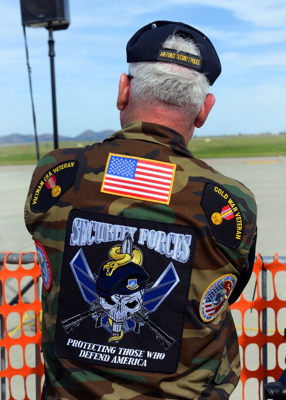 An Air Force veteran watches the U.S. Air Force Thunderbirds during the Wings of Freedom Open House on Altus Air Force Base, Okla., Sept. 13, 2014.