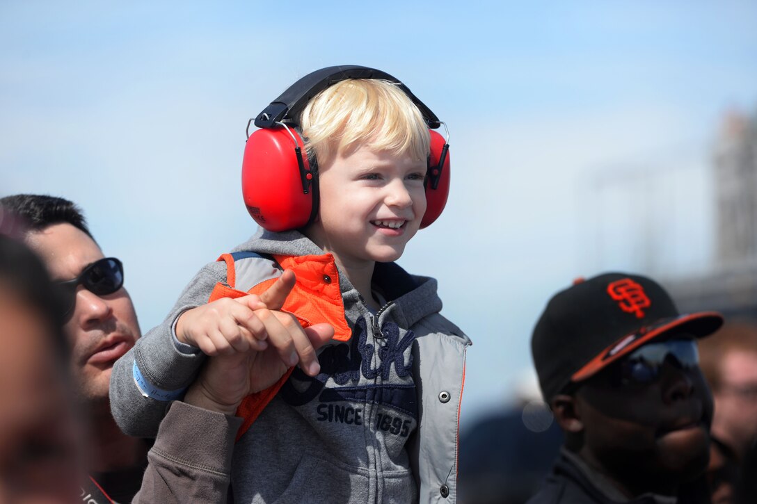 Spectator Steven Hady points out the U.S. Air Force Thunderbirds to his son, Logan, during the Wings of Freedom Open House on Altus Air Force Base, Okla., Sept. 13, 2014.