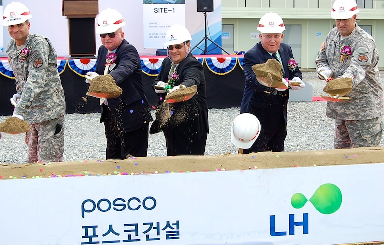 Ground was broken for the new "downtown" area, featuring a new Exchange, commissary and bowling center among other facilities, at Camp Humphreys, Aug. 11, 2014. The project will also see the construction of an auditorium, chapel, chapel family life center, an arts & crafts center, recreation center, plaza and parking. When completed, these facilities will provide retail shopping, groceries, entertainment, recreation and religious services.