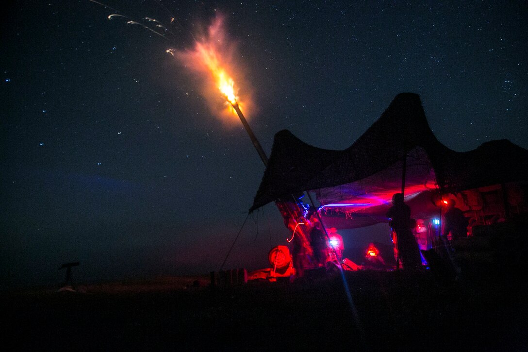 Marines fire an illumination round from an M777A2 lightweight 155 mm during live-fire artillery training Sept. 1 at the Yausubetsu Maneuver Area in Hokkaido as part of Artillery Relocation Training Program 14-2. The illumination round is able to light a 1-by-1-kilometer grid square for two minutes. The Marines are with Battery B, 1st Battalion, 12th Marine Regiment, currently assigned to 3rd Battalion, 12th Marines, 3rd Marine Division, III Marine Expeditionary Force. (U.S. Marine Corps photo by Sgt. Matthew Manning/Released)