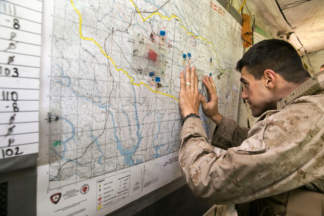 Sgt. Zachary J. Harbour, from Phoenix, Arizona, tracks unit movements in the Yausubetsu Maneuver Area Aug. 31 during Artillery Relocation Training Program 14-2 in Hokkaido, Japan. During the battalion phase of ARTP 14-2, Marines working in the command operations center provided command and control support for all aspects of the live-fire artillery training. Harbor is a chemical, biological, radiological and nuclear defense specialist with the Headquarters Battery, 3rd Battalion, 12th Marine Regiment, 3rd Marine Division, III Marine Expeditionary Force. 