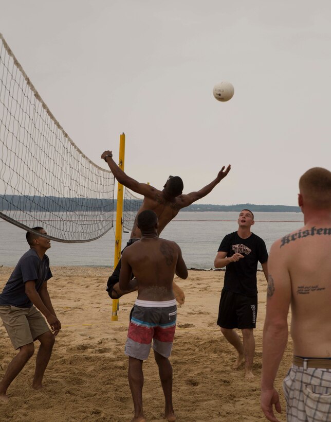Marines with 4th Marine Regiment, 3rd Marine Division, play volleyball during a family day and beach barbeque Sept. 10 at Oura Wan Beach on Camp Schwab. The event took place after the unit’s return from Exercise Koolendong, where the Marines conducted joint training operations with the Australian Army. “We have a lot of things going on next month all the way through Christmas, so this was just an opportunity to take a break and recognize the Marines’ hard work,” said Lt. Col. Jim Sweeney, a Papillon, Nebraska, native and executive officer for Headquarters Company, 4th Marines, 3rd Marine Division, III Marine Expeditionary Force. 