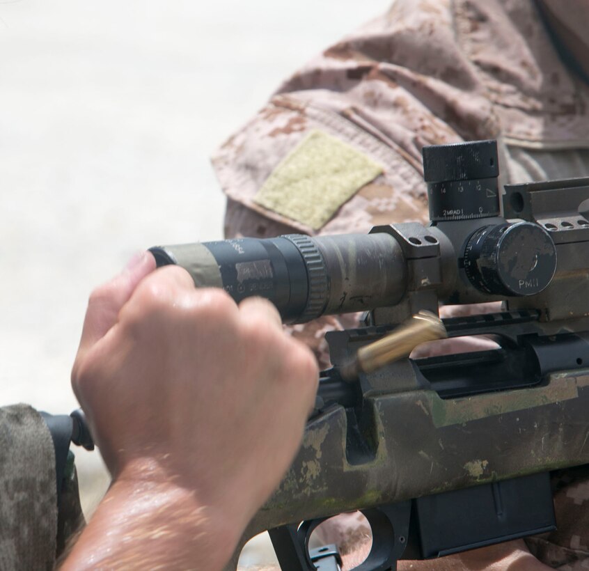 A U.S. Marine ejects a round from the chamber of an M40A5 sniper rifle Aug. 17 at the Central Training Area in Okinawa, Japan. The M40A5 rifle is a bolt-action sniper rifle with a muzzle velocity of 2,550 feet per second and an effective firing range of up to 900 meters. The Marines are with various units assigned to 3rd Marine Division, III Marine Expeditionary Force. 