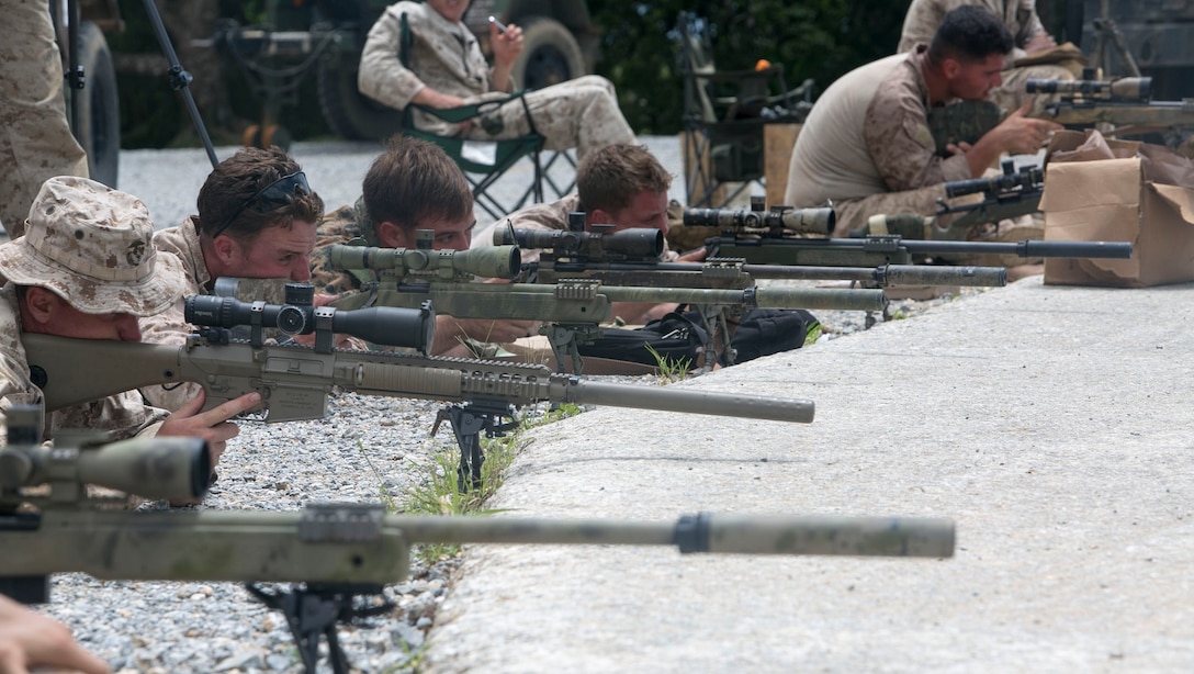 U.S. Marines fire M40A5 sniper rifles Aug. 17 at the Central Training Area in Okinawa, Japan. This course of fire prepares the Marines for the Scout Sniper Basic Course. The M40A5 rifle is a bolt-action sniper rifle with a muzzle velocity of 2,550 feet per second and an effective firing range of up to 900 meters. The Marines are with various units assigned to 3rd Marine Division, III Marine Expeditionary Force. 
