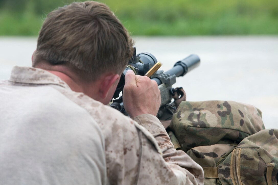 Lance Cpl. Seth M. Richardson, a Carbondale, Illinois, native, ejects a round from the chamber of an M40A5 sniper rifle Aug. 17 during preparation for the Scout Sniper Basic Course at the Central Training Area in Okinawa, Japan. Accuracy is a key element of a scout sniper’s mission as they will sometimes only have one shot to accomplish a mission. Richardson is a reconnaissance man with 3rd Reconnaissance Battalion, 3rd Marine Division, III Marine Expeditionary Force. 