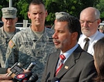 Army Brig. Gen. Patrick Murphy (left) joins New York Gov. David Paterson at a press conference in Gowanda, N.Y., on Aug. 12, 2009, during which Paterson announced that the New York Army National Guard's 152nd Engineer Support Company had been mobilized to clean up the village following a flash flood.